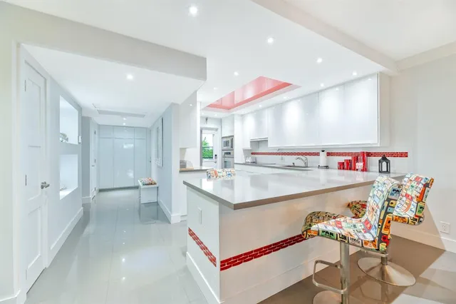 a kitchen with stainless steel appliances granite countertop a sink and cabinets
