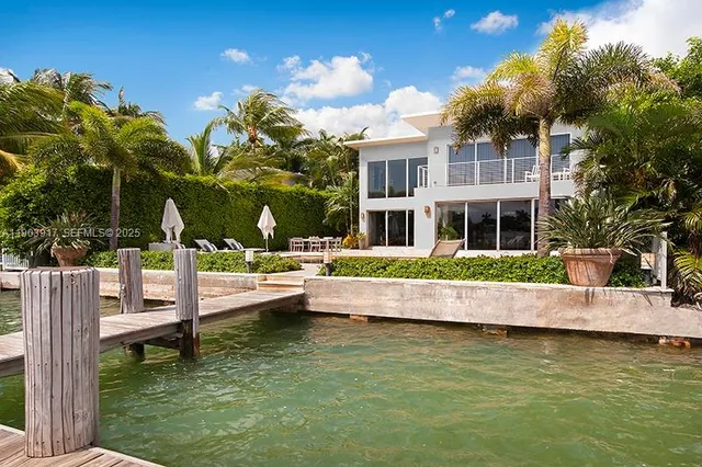 a view of house with swimming pool outdoor seating