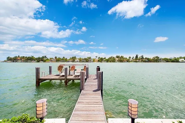 a view of a lake with outdoor seating