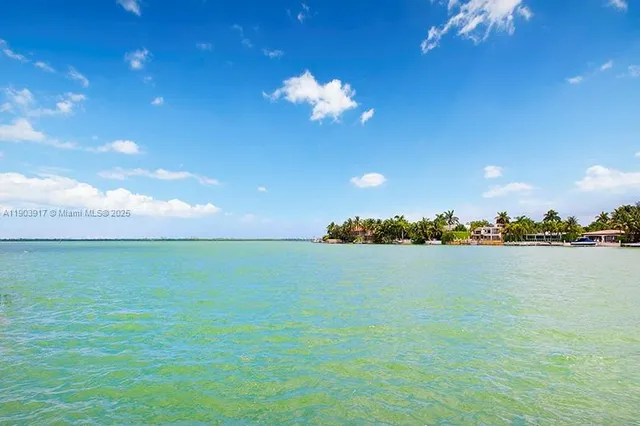 a view of an ocean beach and a city view