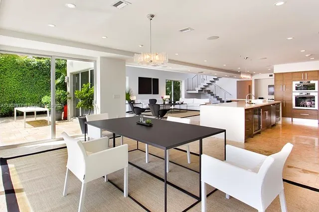 a view of a dining room with furniture window and outside view