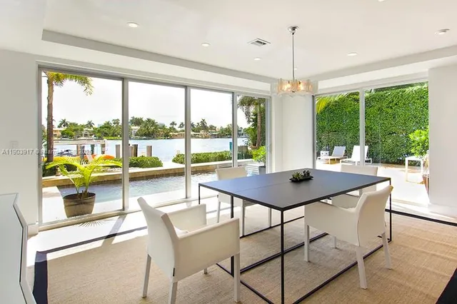 a view of a dining room with furniture and window
