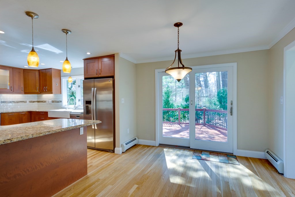 14 Highgate Street Needham, MA 02492 - Photo 13 of 27 a kitchen with refrigerator and window