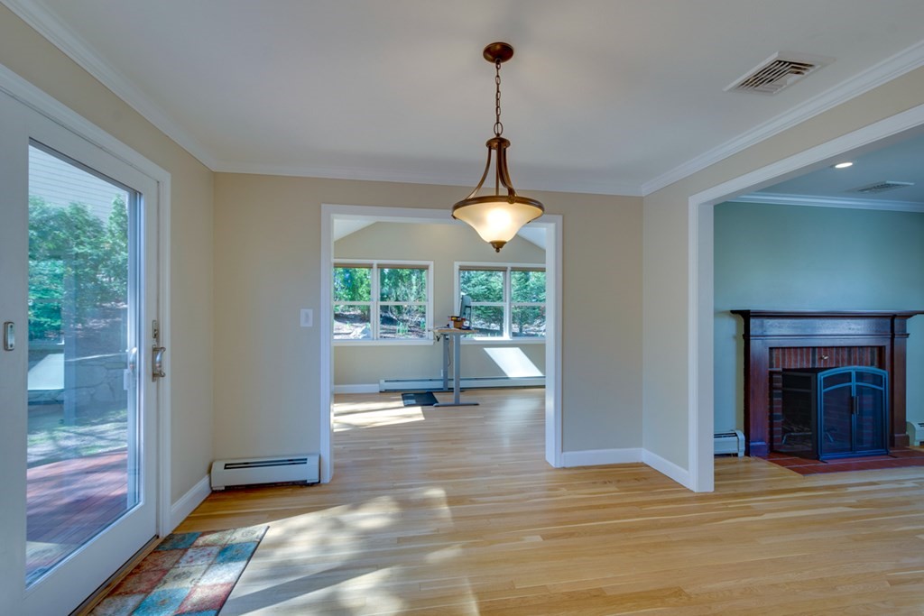 14 Highgate Street Needham, MA 02492 - Photo 15 of 27 a view of empty room with wooden floor and fireplace
