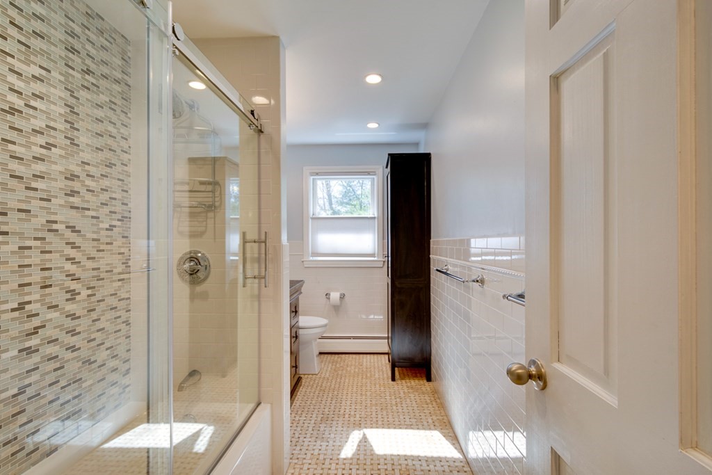 14 Highgate Street Needham, MA 02492 - Photo 17 of 27 a bathroom with a shower