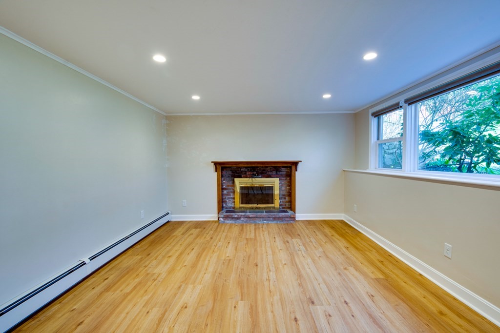 14 Highgate Street Needham, MA 02492 - Photo 22 of 27 a view of an empty room with a window and wooden floor