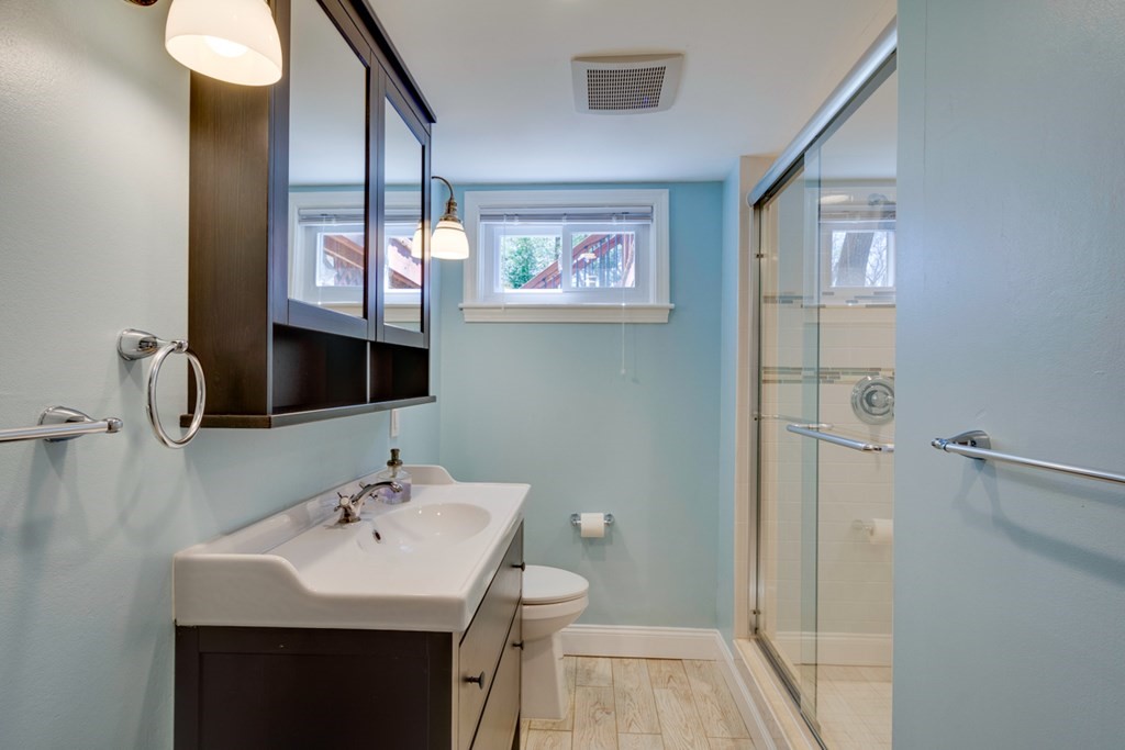 14 Highgate Street Needham, MA 02492 - Photo 23 of 27 a bathroom with a sink and a mirror