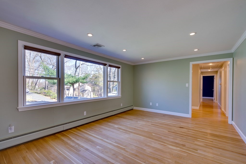 14 Highgate Street Needham, MA 02492 - Photo 8 of 27 a view of empty room with wooden floor and fan