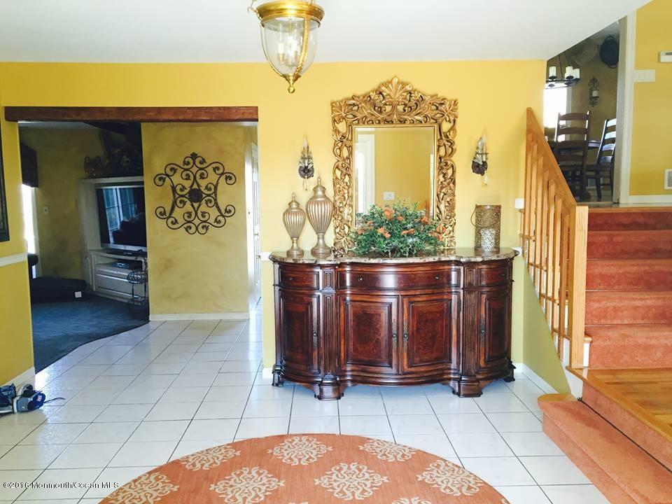 146 Old Post Road Freehold, NJ 07728 - Photo 2 of 15 a view of front door with hallway