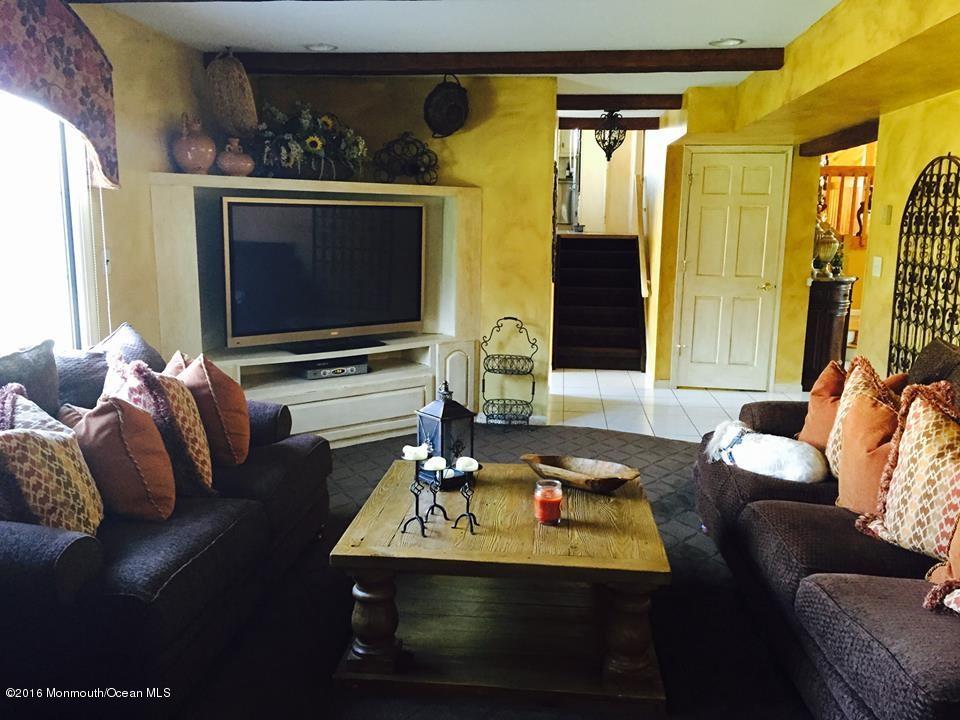 146 Old Post Road Freehold, NJ 07728 - Photo 7 of 15 a living room with furniture and a flat screen tv