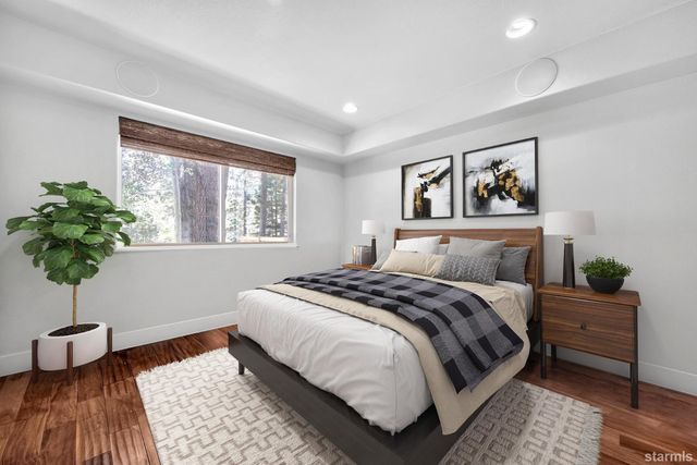 a bathroom with a sink toilet mirror and tub