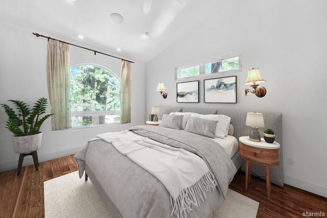a bathroom with a granite countertop sink a toilet and a mirror