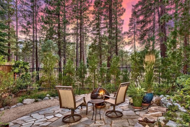 a view of a chairs and table in the outdoor