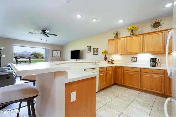 a kitchen with cabinets a sink and appliances