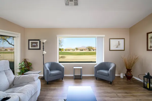 a living room with furniture and a large window
