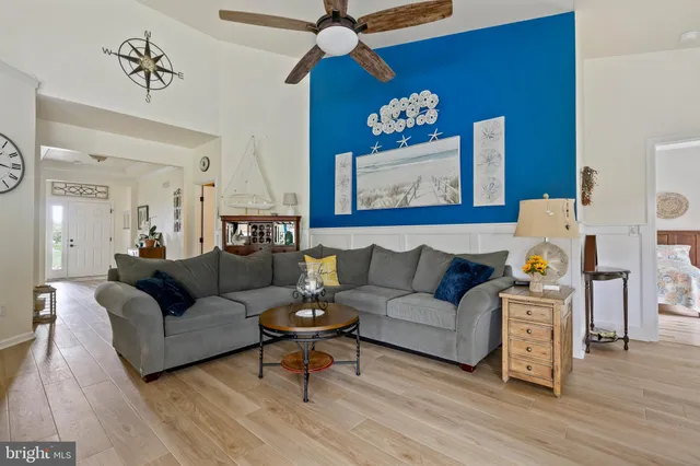 a living room with furniture kitchen view and a fireplace