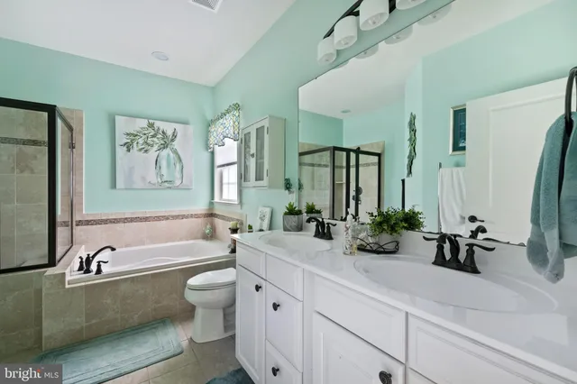 a bathroom with a tub and a shower