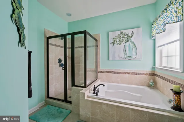 a bedroom with a bed and a chair