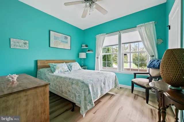 a bedroom with bed and window