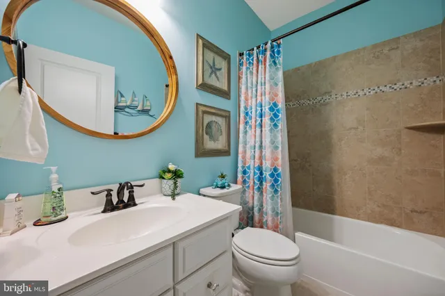 a view of a livingroom with furniture and a flat screen tv