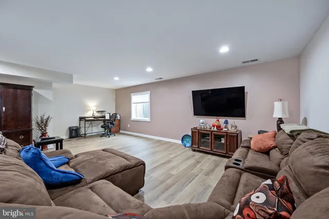 a bathroom with a toilet a sink and a mirror