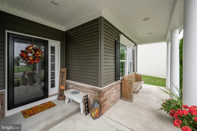 a front view of a house with a yard table and chairs