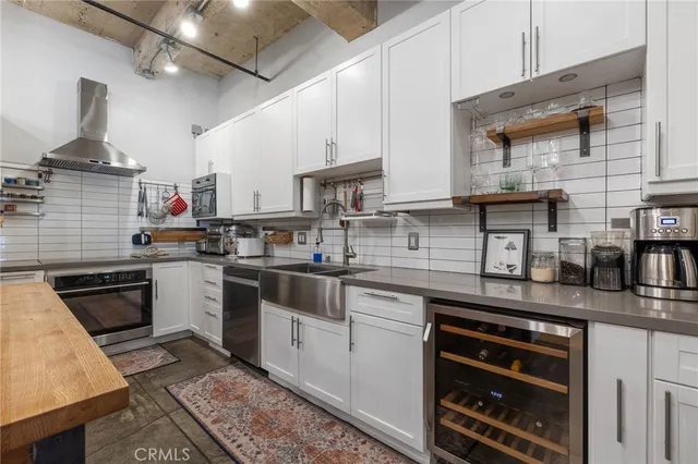 a kitchen with stainless steel appliances granite countertop a stove and a refrigerator
