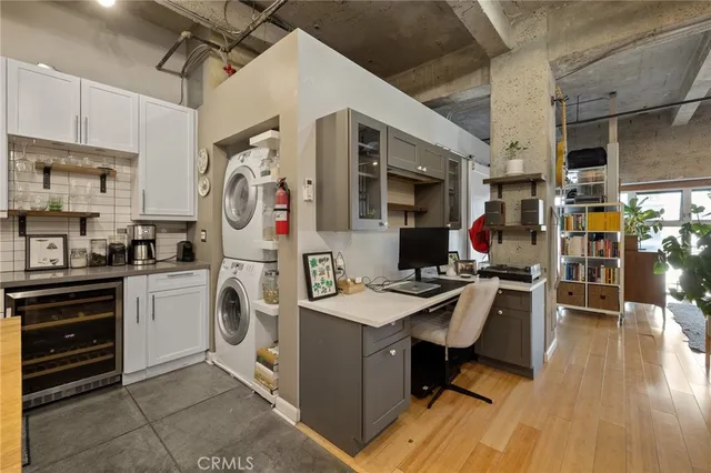 a bedroom with a large bed and a large window