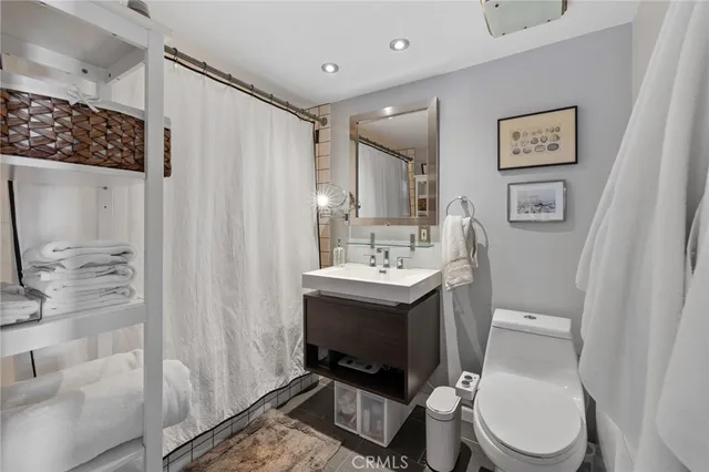 a living room with fireplace furniture and a fireplace