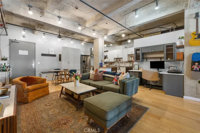 a view of a livingroom with furniture and a window