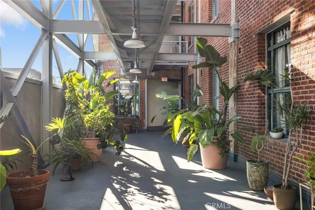a backyard of a house with outdoor seating