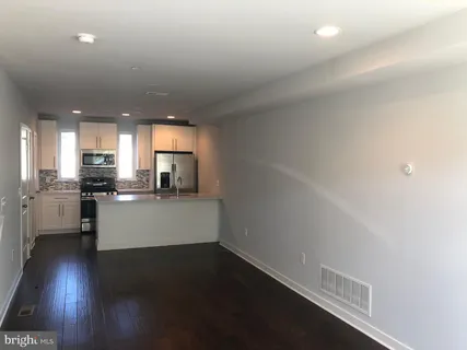 a view of kitchen with wooden floor