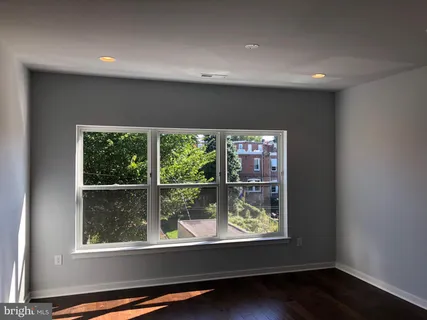 a view of an empty room with a window