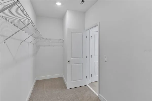 a bathroom with a double vanity sink and mirror