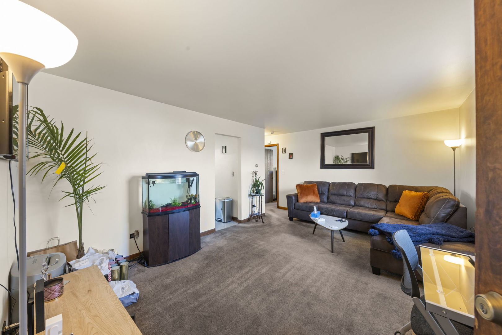 5700 St Charles Road Berkeley, IL 60163 - Photo 4 of 17 a living room with furniture and a couch