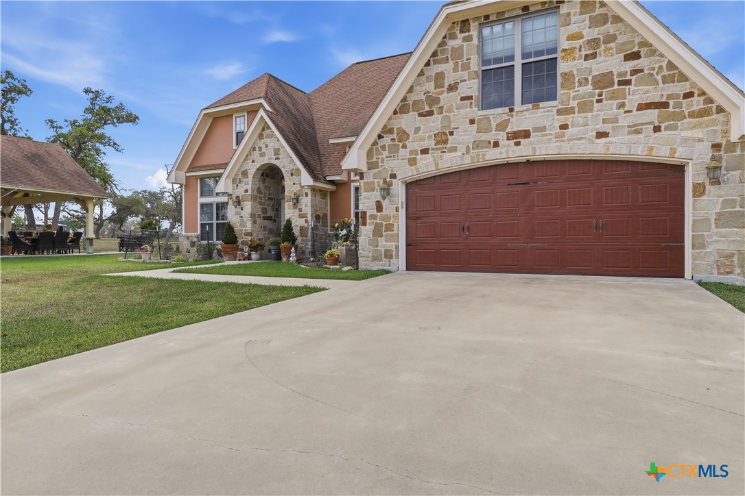 790 Spanish Grant Road Goliad, TX 77963 - Photo 2 of 41 a front view of a house with a yard