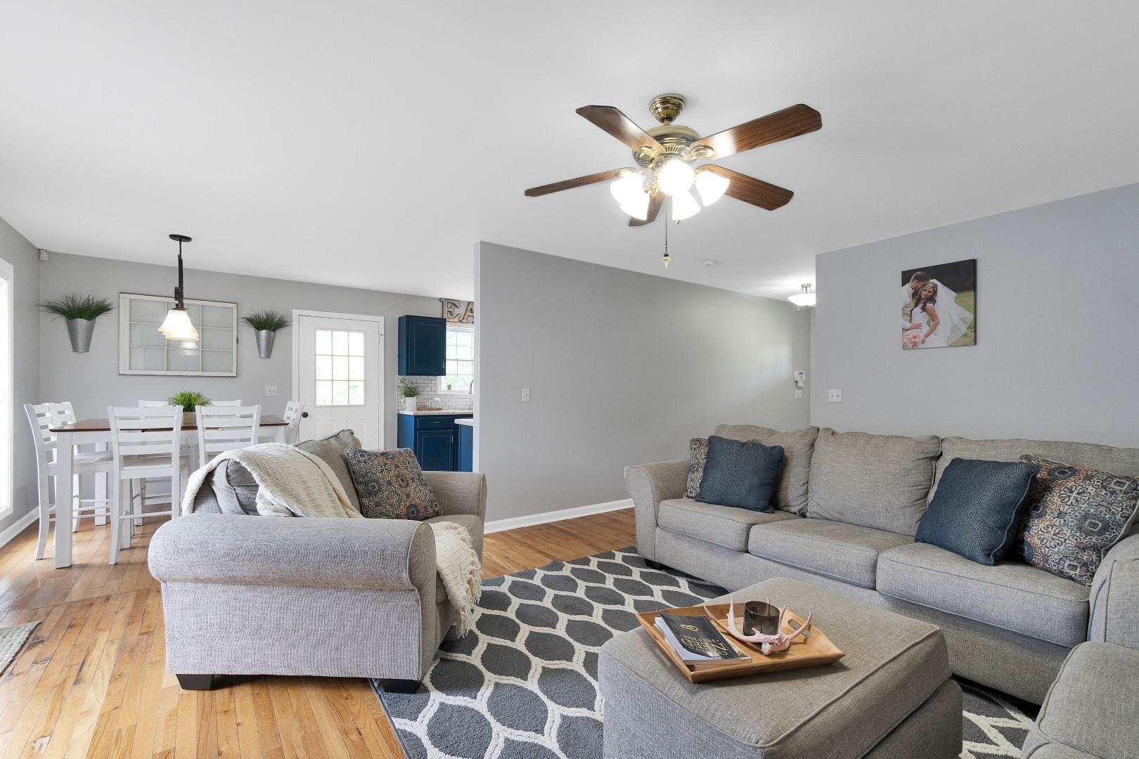 2225 Alvin Head Road Springfield, TN 37172 - Photo 11 of 24 a living room with furniture and a chandelier