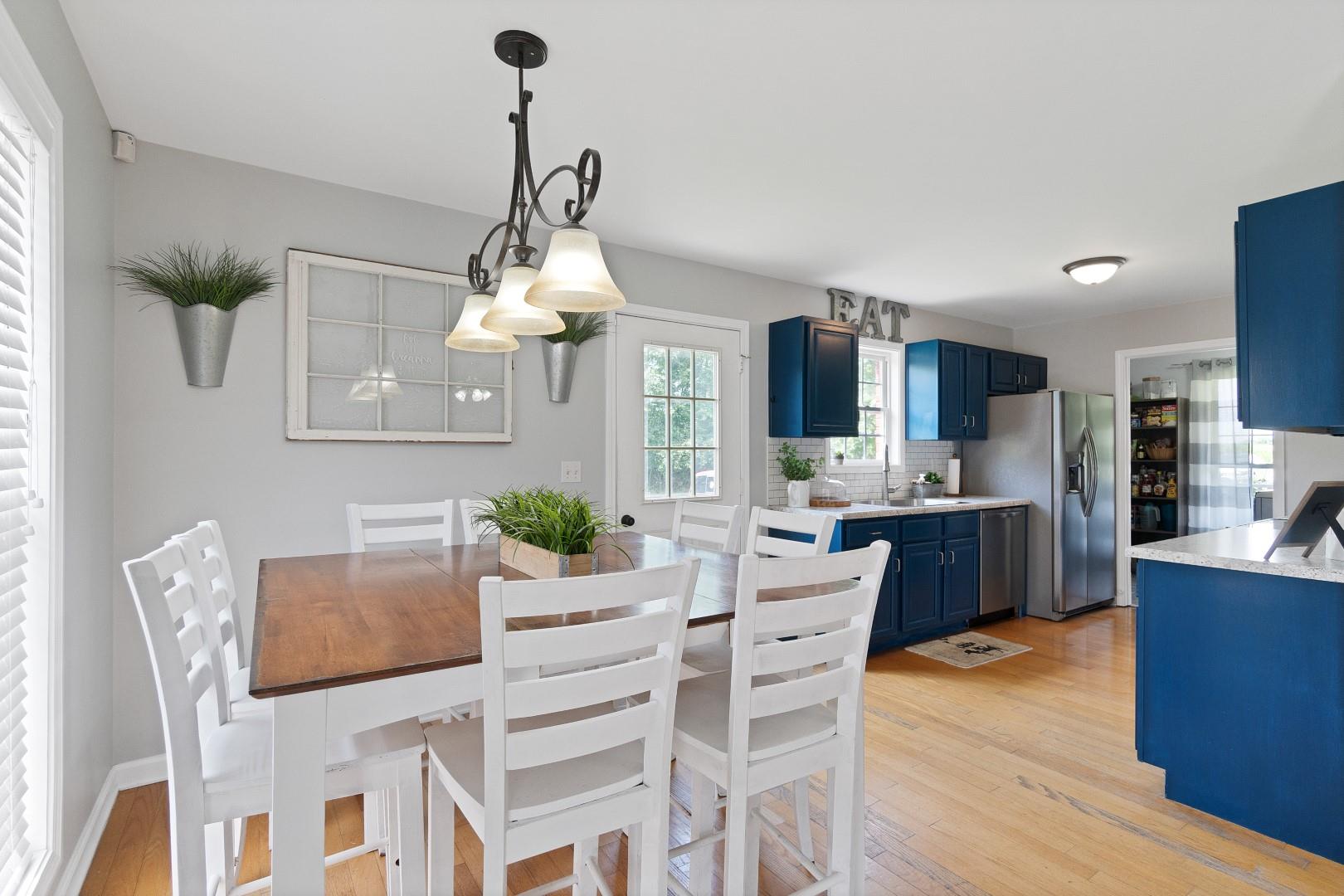 2225 Alvin Head Road Springfield, TN 37172 - Photo 13 of 24 a kitchen with stainless steel appliances kitchen island granite countertop a dining table chairs and white cabinets