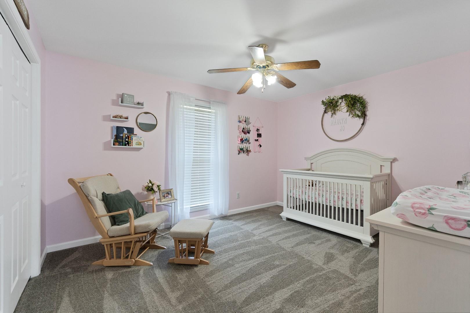 2225 Alvin Head Road Springfield, TN 37172 - Photo 23 of 24 a bedroom with a baby bed chair and a window