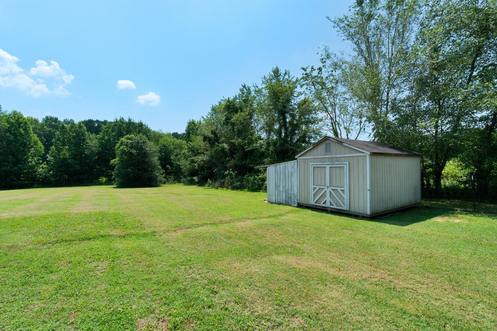 2225 Alvin Head Road Springfield, TN 37172 - Photo 8 of 24 a view of a big yard with large trees