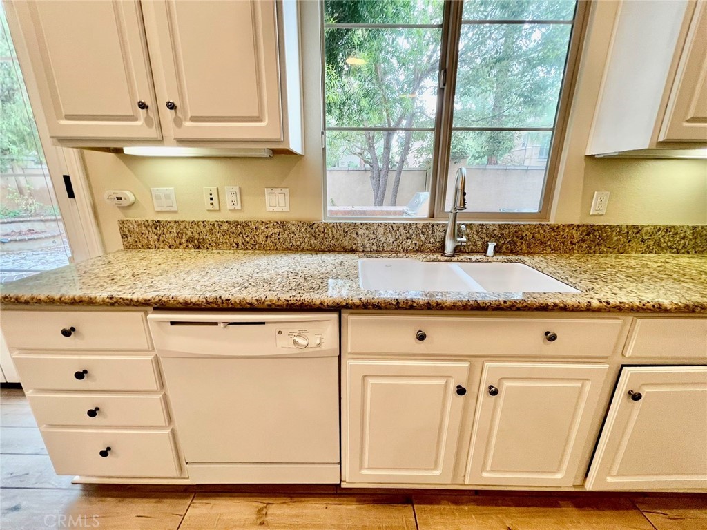 181 Rhapsody Irvine, CA 92620 - Photo 24 of 73 a view of granite countertop white cabinets and a window