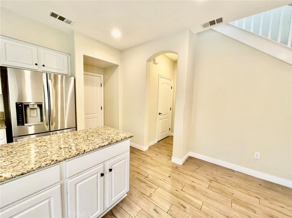 181 Rhapsody Irvine, CA 92620 - Photo 29 of 73 a bathroom with a granite countertop sink and a mirror