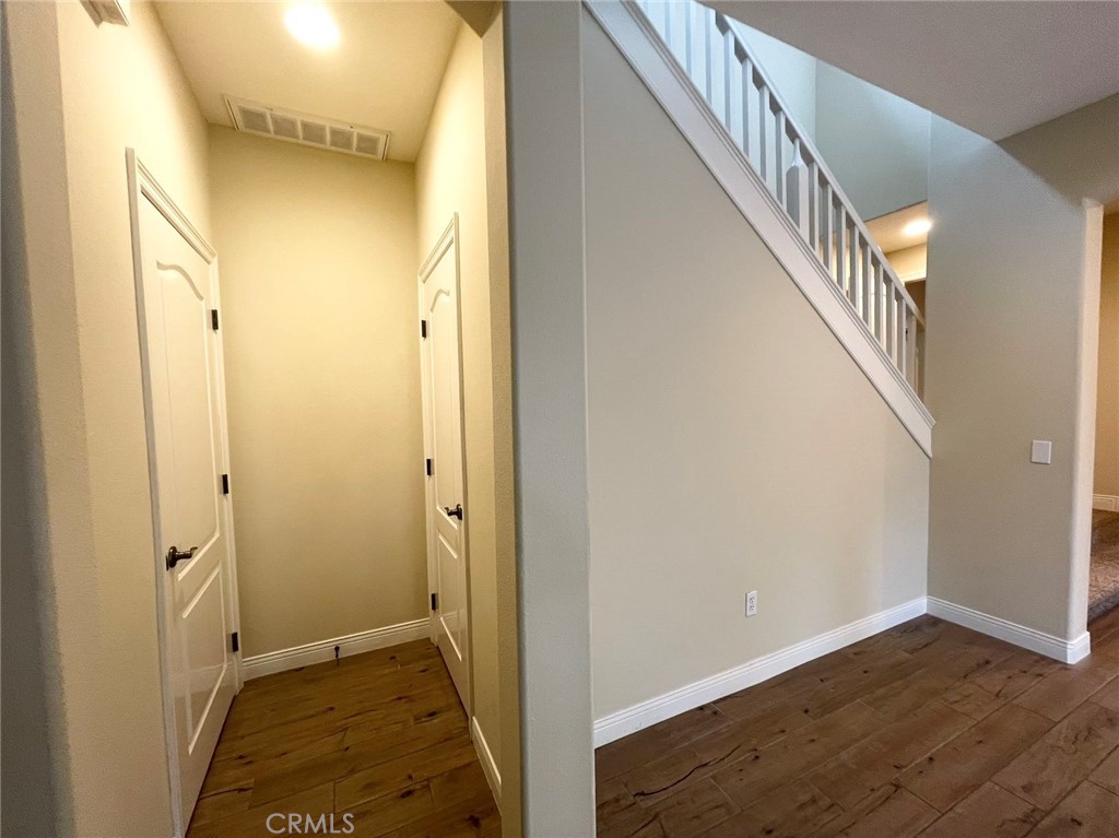 181 Rhapsody Irvine, CA 92620 - Photo 30 of 73 a view of hallway with wooden floor