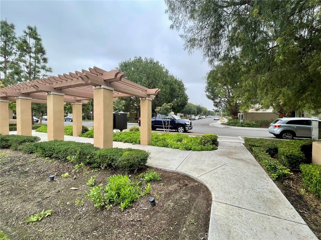 181 Rhapsody Irvine, CA 92620 - Photo 3 of 73 a front view of a house with a yard and trees