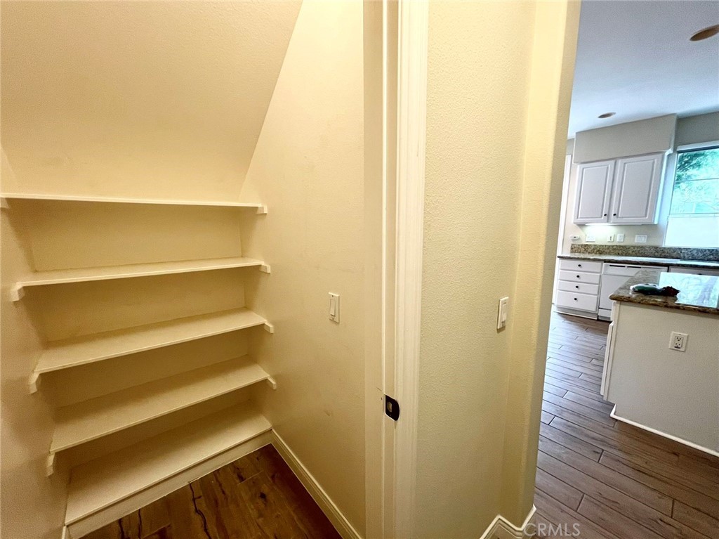 181 Rhapsody Irvine, CA 92620 - Photo 34 of 73 a view of kitchen with wooden floor and cabinets