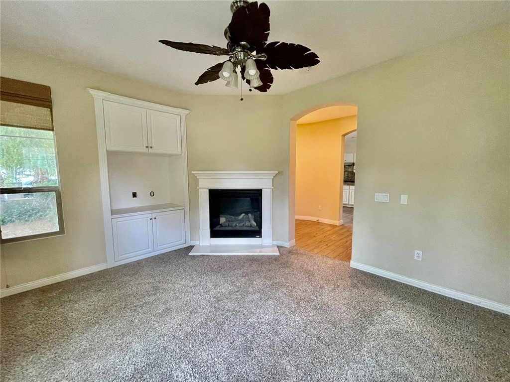 181 Rhapsody Irvine, CA 92620 - Photo 36 of 73 a view of an empty room with a fireplace and a window