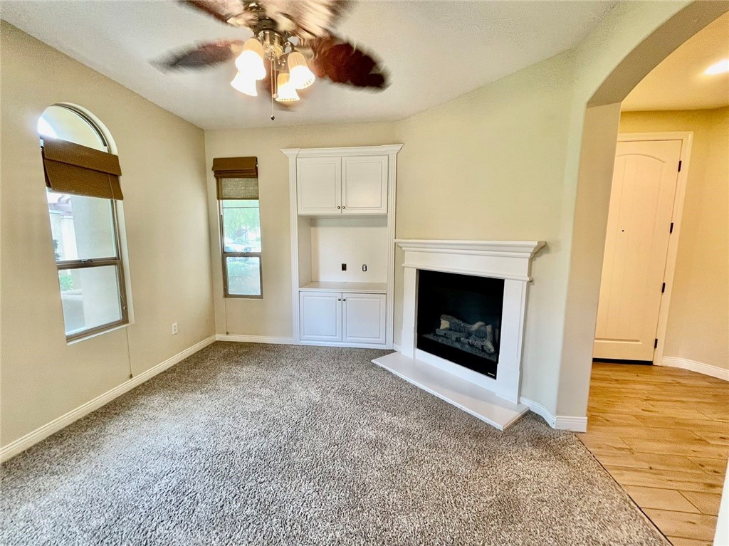 181 Rhapsody Irvine, CA 92620 - Photo 37 of 73 a view of an empty room with window and chandelier fan