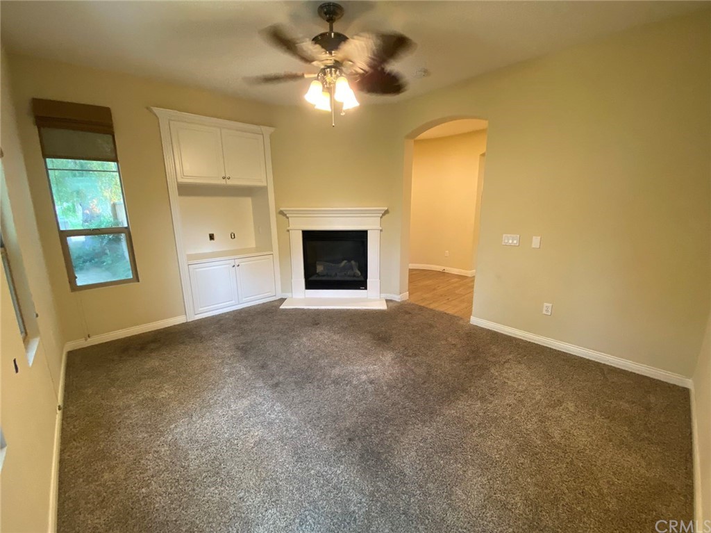 181 Rhapsody Irvine, CA 92620 - Photo 40 of 73 a view of an empty room with a fireplace and a window