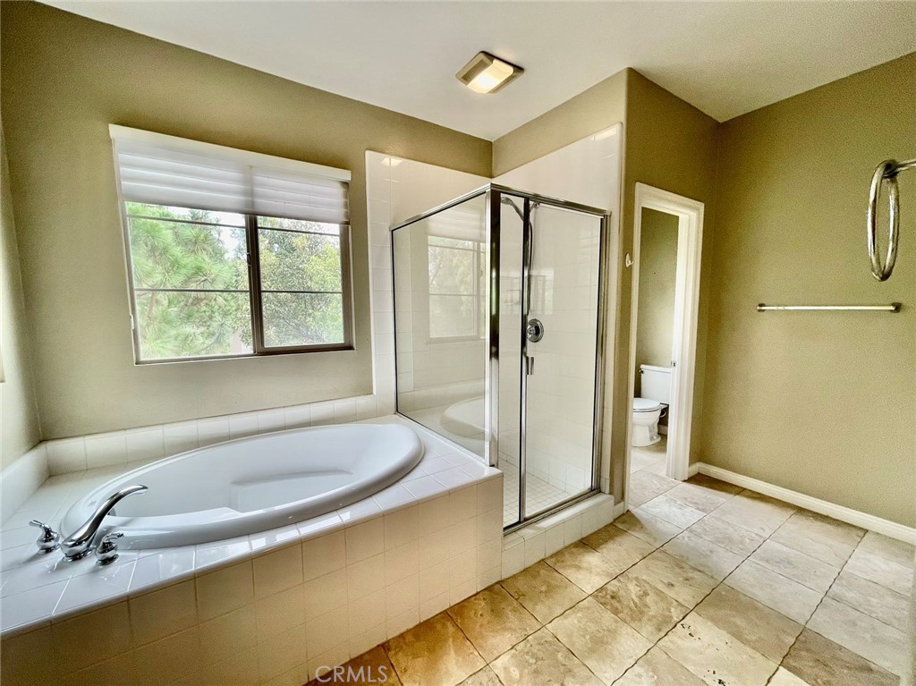 181 Rhapsody Irvine, CA 92620 - Photo 47 of 73 a bathroom with a tub a sink and a shower