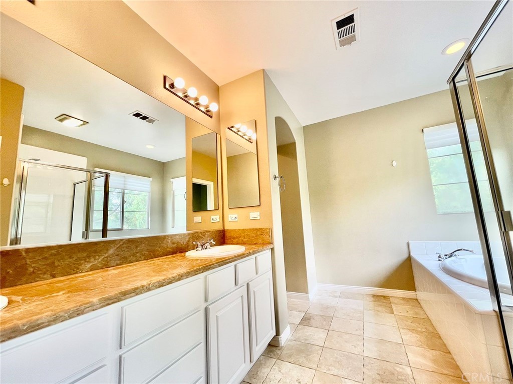 181 Rhapsody Irvine, CA 92620 - Photo 49 of 73 a view of a bathroom with sink and a tub
